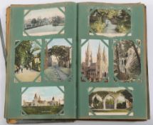 An early 20th century postcard album of
