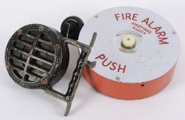 A hand-operated alloy air raid siren the