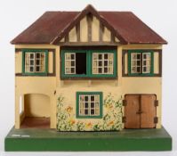 A Triang dolls house and furniture:.