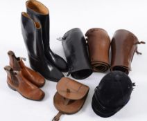 Two pairs of black riding boots, a pair