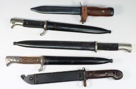 Three German dress bayonets, together wi