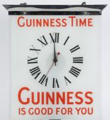 A  glass and chrome 'Guinness Time' adve