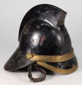 An early black leather fireman's helmet,