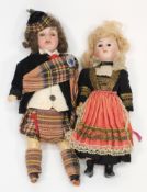 A pair of German bisque headed Highland