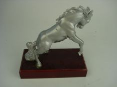 A White Truck mustang mascot; depicting