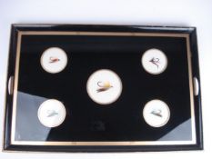 An ebonised two handled tray inset with