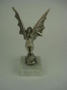 A nickel plated winged nymph mascot circ