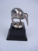 A plated kiwi car mascot:, on later blac