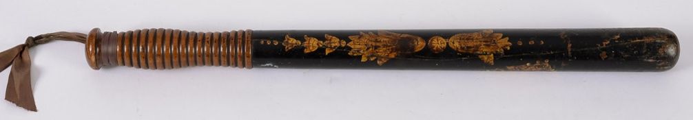 A black and polychrome decorated wooden