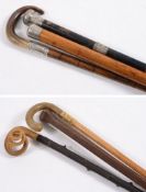 Two Silver mounted walking canes, a silv