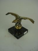 A brass Lejeune style eagle mascot, stam