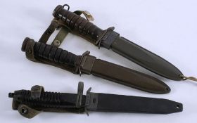 Two US M8A1 style daggers and one other