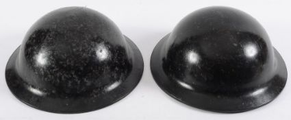 Two post war safety helmets: of circular