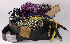 A collection of military belts, webbing