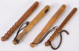 Four various plain turned wood truncheon