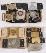 A collection of  police belt buckles fro
