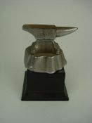 A plated blacksmiths anvil mascot:, regi
