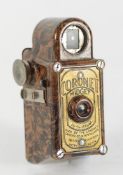 A Coronet Midget in brown marbled bakeli