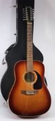 A Simon & Patrick twelve string guitar,