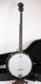 An Ozark five string banjo in fitted cas