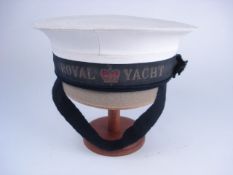 A Royal Navy cap with 'Royal Yacht' tall