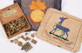 A collection of various cap badges and b