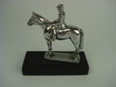 A chrome plated equestrian mascot by Lej