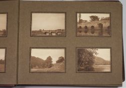 An album of photographs including views,