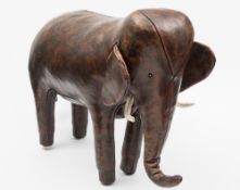 A leather foot stool in the form of an e