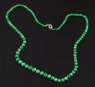 A graduated green jade bead single strin