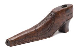 A 19th century treen pipe in the form of