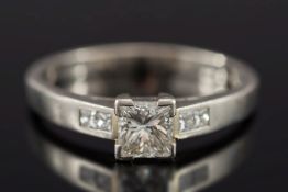 A platinum and princess-cut diamond sing
