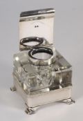A George V silver mounted glass inkwell,