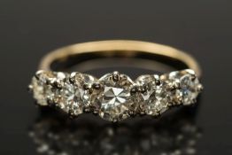 A diamond five-stone ring: with graduate