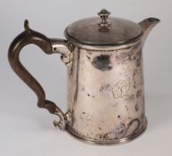 An antique silver hot water jug: unmarke