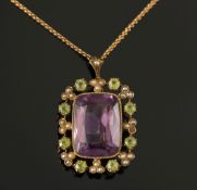 A rectangular amethyst, peridot and seed