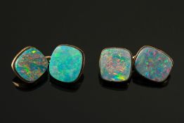A pair of opal doublet mounted cuff-link