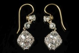 A pair of diamond mounted pendant earrin