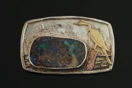 A boulder opal mounted rectangular brooc