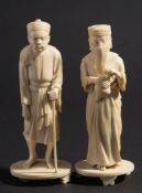 A pair of Burmese carved ivory figures: