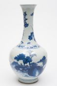 A Chinese blue and white bottle vase: wi