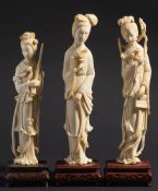 A pair of Chinese carved ivory figures:
