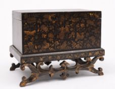 An early 19th century lacquer and gilt b