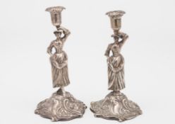 A George III silver figural taperstick,