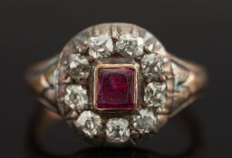 A ruby and diamond oval cluster ring:, w
