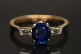A sapphire and diamond three-stone ring: