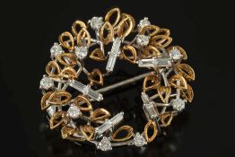 A modern diamond mounted circular brooch