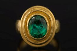 A 22ct gold and oval green tourmaline si