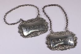 A pair of George IV silver spirit labels