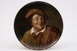 A Galle pottery plaque: of circular form